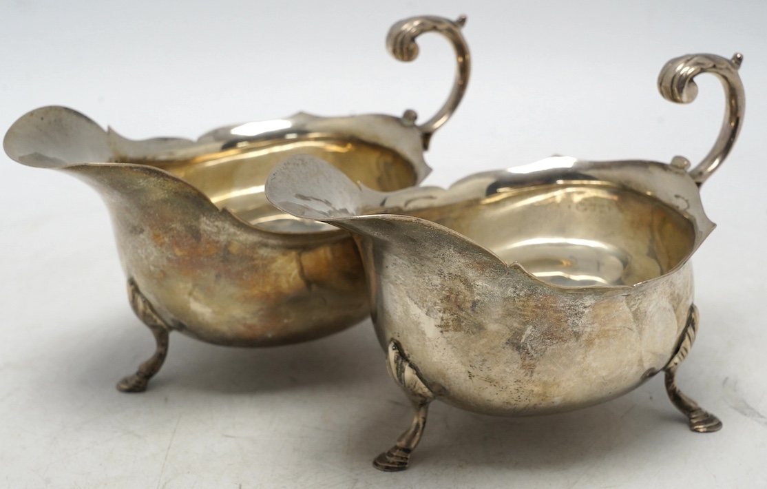 A pair of George V silver sauce boats, Nathan & Hayes, Chester, 1915, length 16.1cm, 12.6oz. Condition - fair